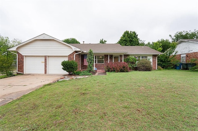 single story home with a garage, brick siding, a front yard, and driveway