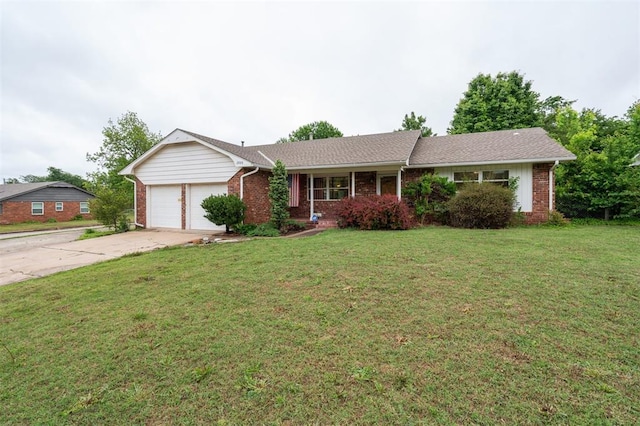 ranch-style home with a garage, brick siding, driveway, and a front yard