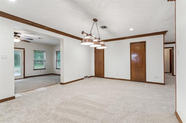 spare room with light colored carpet, crown molding, baseboards, ceiling fan, and recessed lighting
