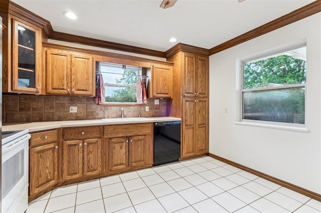 kitchen featuring black dishwasher, a sink, brown cabinets, and ornamental molding