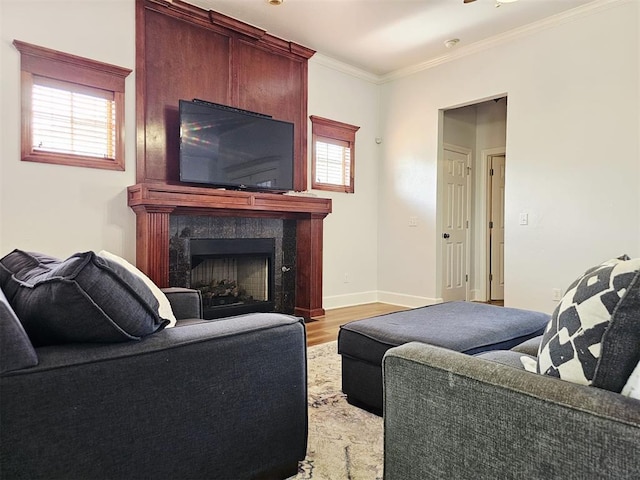 12401 SW 7th St, Yukon, OK 73099 - living area with light wood-type flooring, a premium fireplace, crown molding, and baseboards