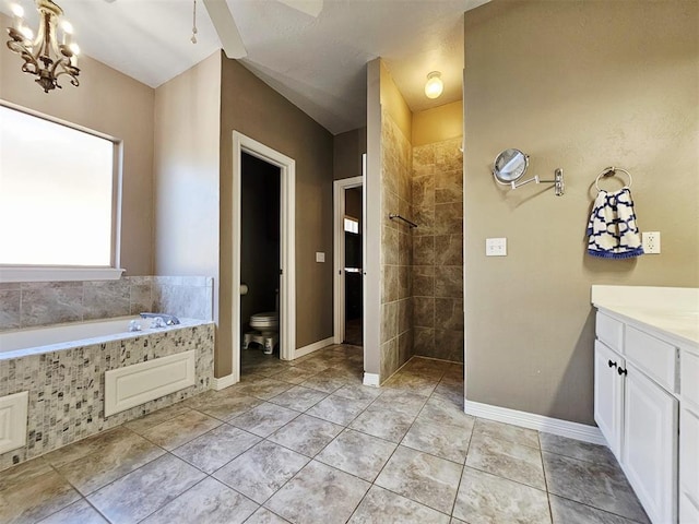 12401 SW 7th St, Yukon, OK 73099 - full bathroom featuring a walk in shower, toilet, a garden tub, a chandelier, and vanity