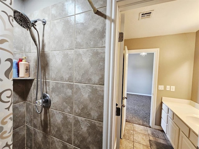 12401 SW 7th St, Yukon, OK 73099 - full bath featuring a tile shower, vanity, and stone finish floors