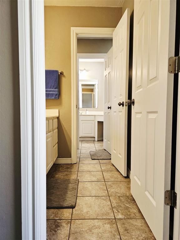 12401 SW 7th St, Yukon, OK 73099 - bathroom featuring vanity, tile patterned floors, and baseboards