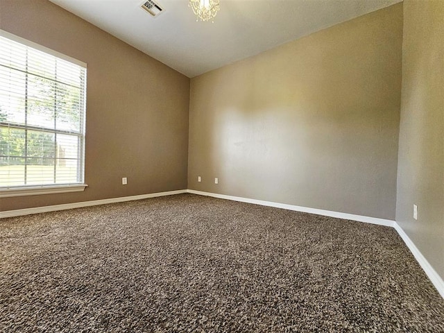12401 SW 7th St, Yukon, OK 73099 - unfurnished room with carpet flooring, baseboards, and vaulted ceiling