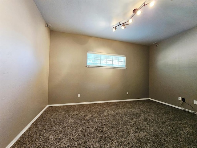 12401 SW 7th St, Yukon, OK 73099 - carpeted spare room with baseboards and track lighting