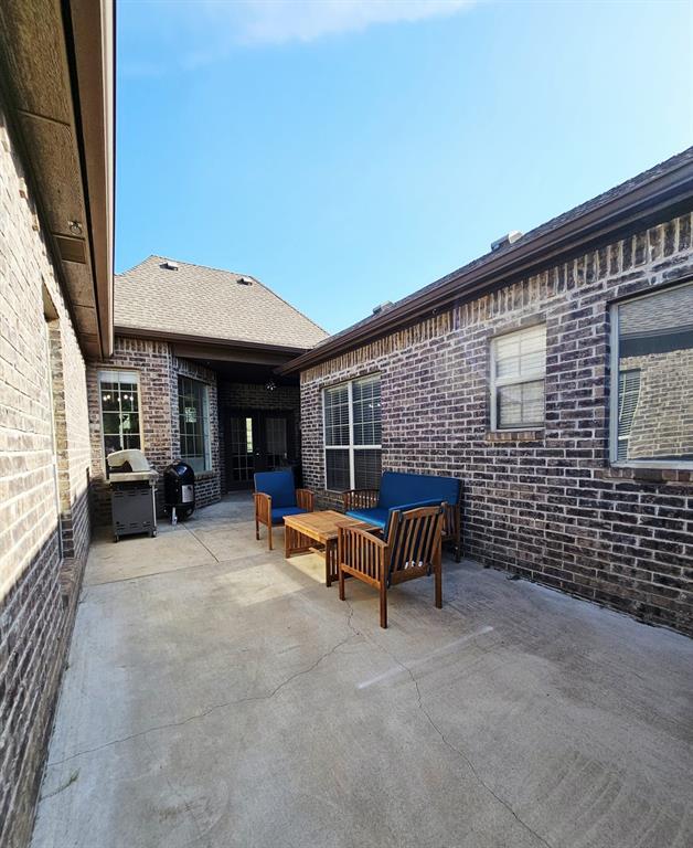 12401 SW 7th St, Yukon, OK 73099 - view of patio / terrace with outdoor lounge area and grilling area