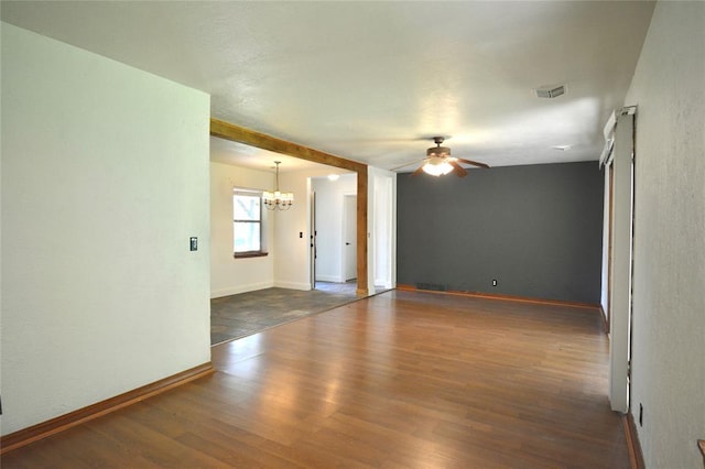 3708 NW 59th St, Oklahoma City, OK 73112 - unfurnished room featuring a chandelier, a ceiling fan, wood finished floors, and baseboards