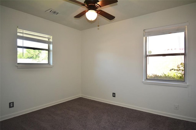 3708 NW 59th St, Oklahoma City, OK 73112 - spare room featuring dark carpet, ceiling fan, and baseboards