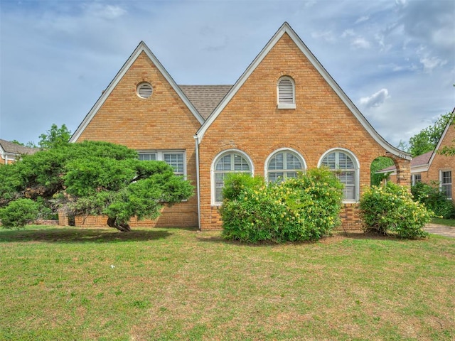 2617 NW 23rd St, Oklahoma City, OK 73107 - view of front of home featuring a front lawn and brick siding
