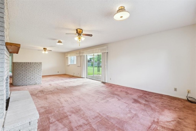 1009 Cherokee Pl, Lindsay, OK 73052 - unfurnished living room featuring ceiling fan, light carpet, and a textured ceiling