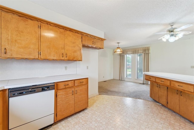 1009 Cherokee Pl, Lindsay, OK 73052 - kitchen with dishwasher, light countertops, a ceiling fan, brown cabinetry, and a textured ceiling