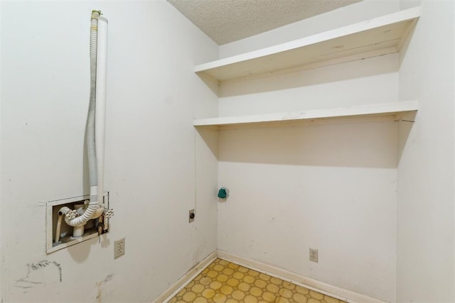 1009 Cherokee Pl, Lindsay, OK 73052 - laundry area featuring electric dryer hookup, light floors, and baseboards