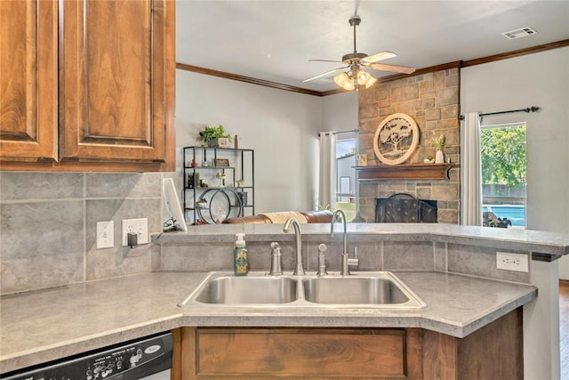 8701 Long Spur Trl, Edmond, OK 73034 - kitchen featuring a sink, dishwashing machine, crown molding, ceiling fan, and decorative backsplash