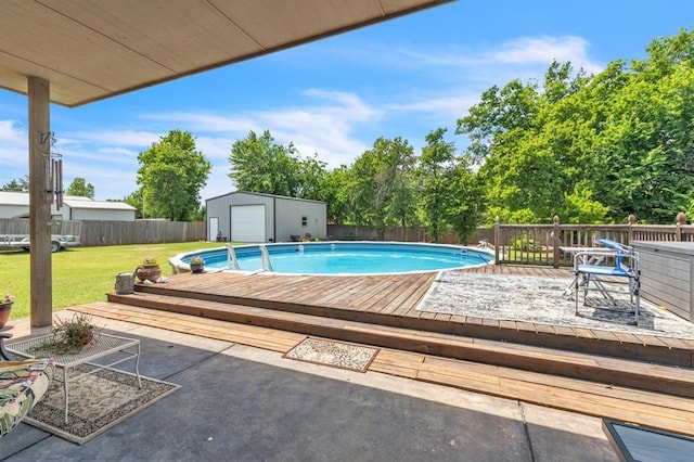 8701 Long Spur Trl, Edmond, OK 73034 - view of swimming pool featuring a deck and an outdoor structure