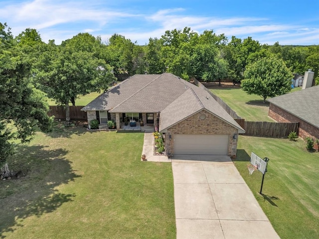 8701 Long Spur Trl, Edmond, OK 73034 - view of front of home featuring a garage, concrete driveway, stone siding, a porch, and a shingled roof