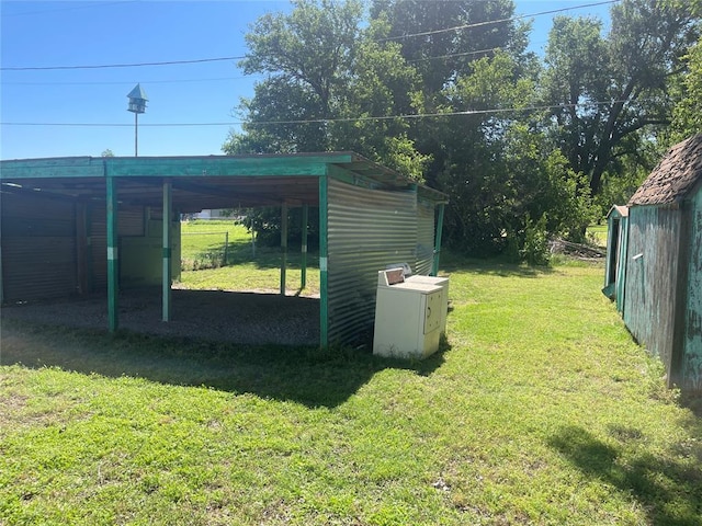 811 N Admire Ave, El Reno, OK 73036 - view of green lawn featuring a carport