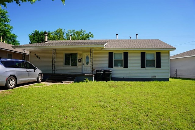4753 SE 17th St, Oklahoma City, OK 73115 - view of front facade featuring a front yard, covered porch, and a shingled roof