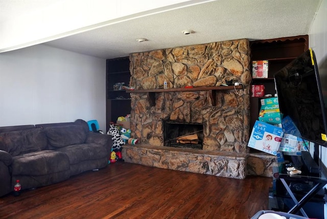 4753 SE 17th St, Oklahoma City, OK 73115 - living room featuring wood finished floors and a fireplace