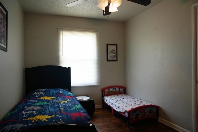 4753 SE 17th St, Oklahoma City, OK 73115 - bedroom featuring wood finished floors, a ceiling fan, and baseboards