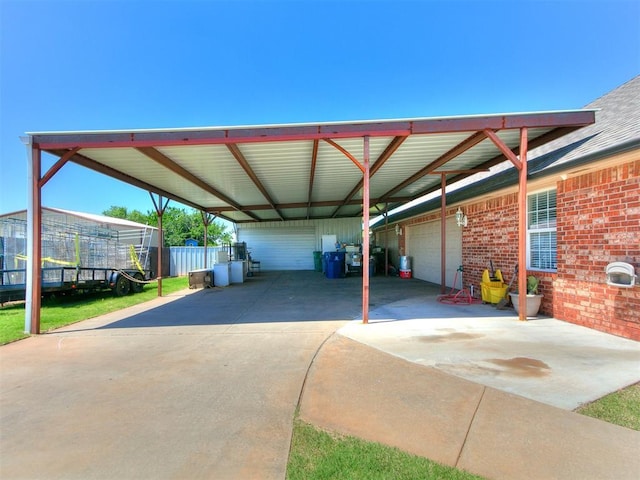 9315 Fendrych Dr, Oklahoma City, OK 73165 - view of parking / parking lot featuring a garage and concrete driveway