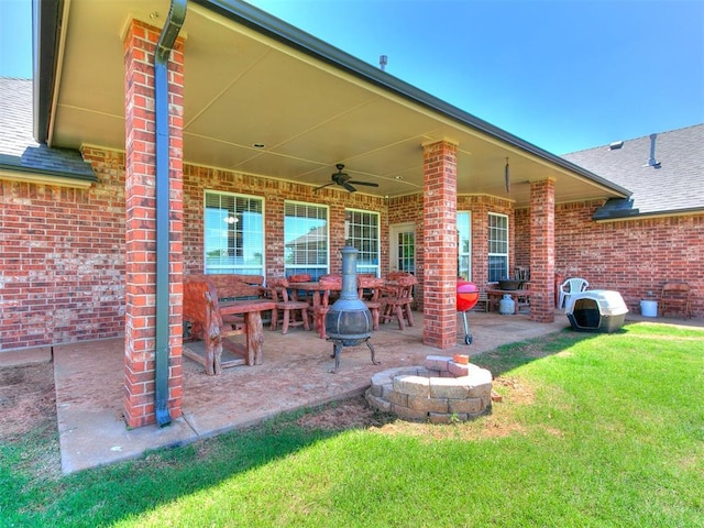 9315 Fendrych Dr, Oklahoma City, OK 73165 - view of patio / terrace featuring ceiling fan and a fire pit