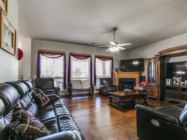 9315 Fendrych Dr, Oklahoma City, OK 73165 - living room featuring a ceiling fan, healthy amount of natural light, a fireplace, and wood finished floors