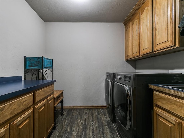 9315 Fendrych Dr, Oklahoma City, OK 73165 - laundry area with dark wood-style floors, cabinet space, washer and clothes dryer, baseboards, and a textured ceiling