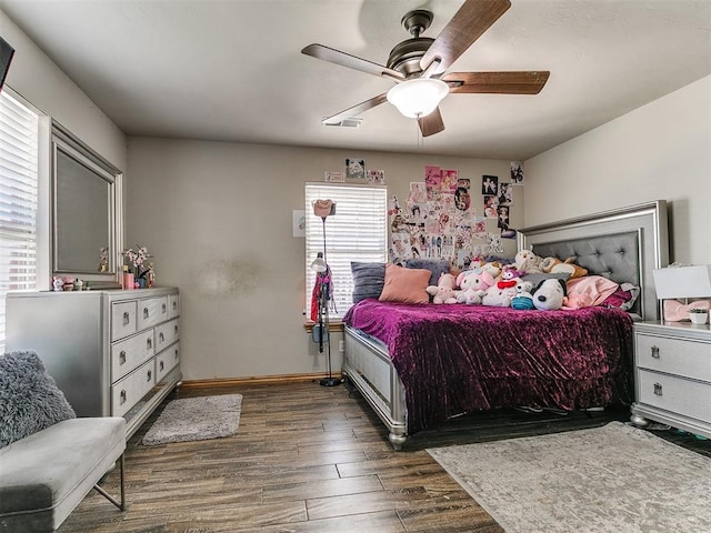 9315 Fendrych Dr, Oklahoma City, OK 73165 - bedroom featuring multiple windows, dark wood-style floors, baseboards, and a ceiling fan