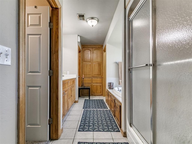 9315 Fendrych Dr, Oklahoma City, OK 73165 - full bathroom featuring tile patterned flooring, a bath, a shower stall, and vanity