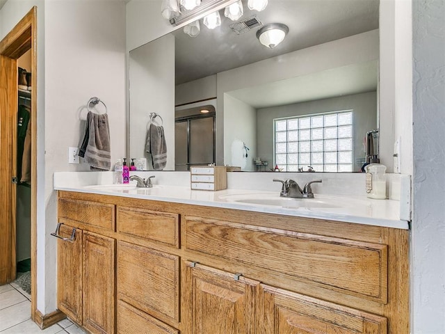 9315 Fendrych Dr, Oklahoma City, OK 73165 - bathroom with double vanity and tile patterned floors