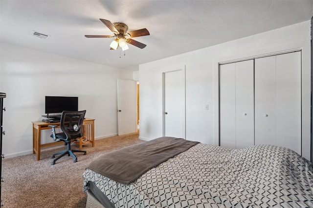 carpeted bedroom featuring baseboards, ceiling fan, and a desk
