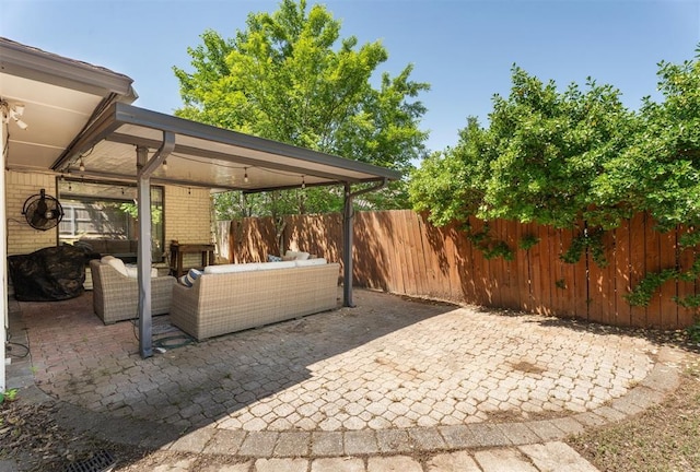 view of patio / terrace with an outdoor hangout area and a fenced backyard