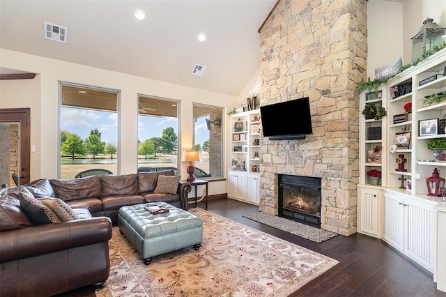 living area featuring a fireplace, dark wood finished floors, and high vaulted ceiling