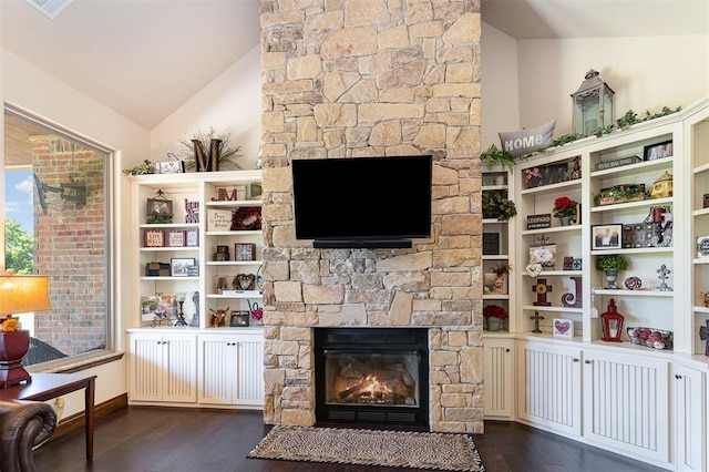 living room featuring a fireplace, dark wood-style floors, and lofted ceiling