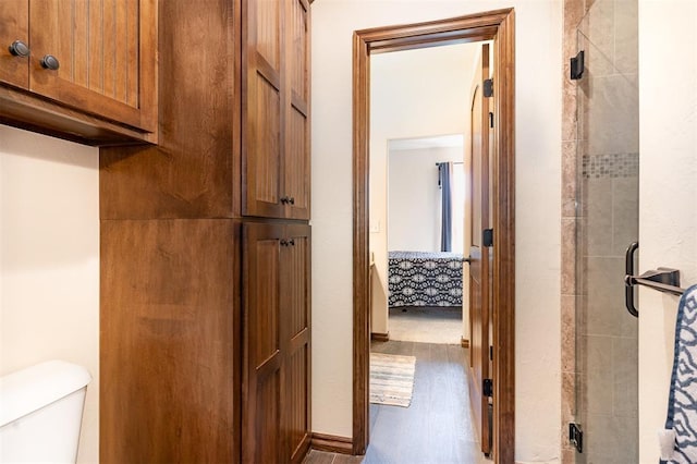 corridor featuring wood finished floors