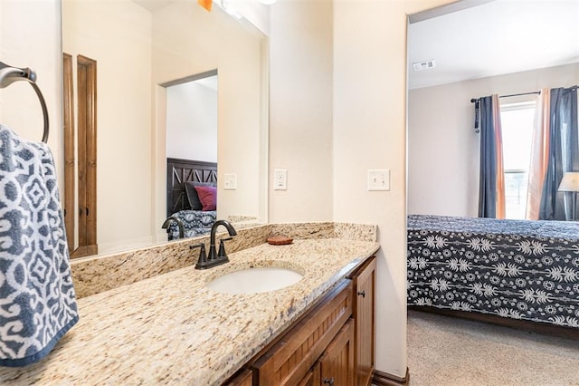 ensuite bathroom featuring vanity