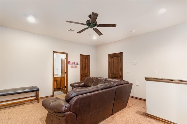 living area featuring light colored carpet, ceiling fan, recessed lighting, and baseboards