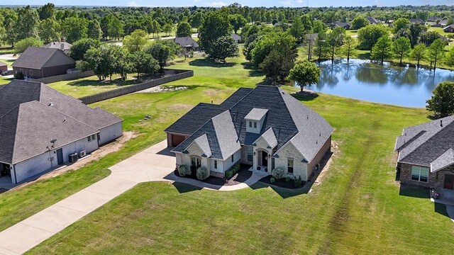 aerial view of residential area featuring a nearby body of water