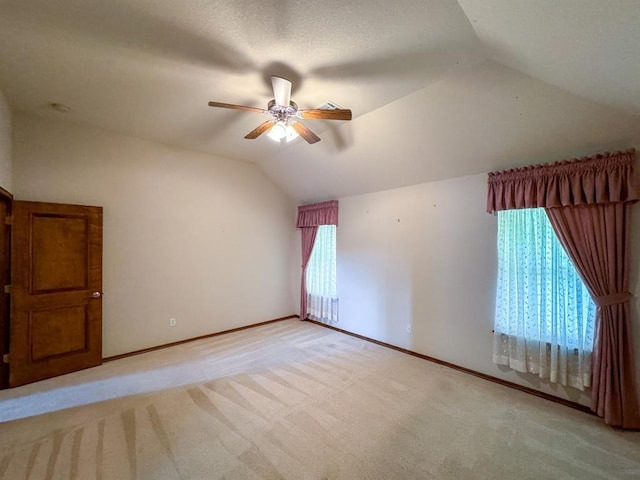 3424 Teton Ct, Norman, OK 73072 - additional living space featuring vaulted ceiling, ceiling fan, light carpet, and baseboards
