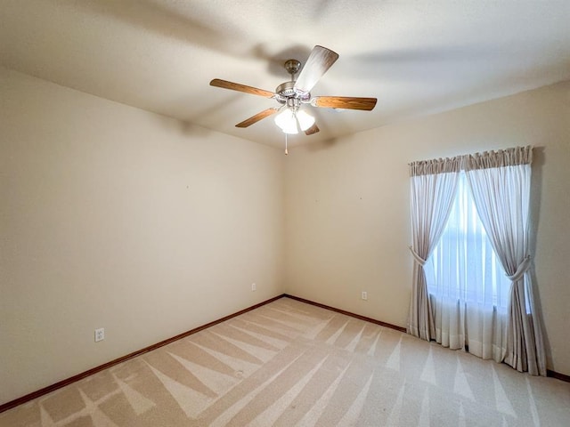 3424 Teton Ct, Norman, OK 73072 - unfurnished room with ceiling fan, baseboards, and light carpet