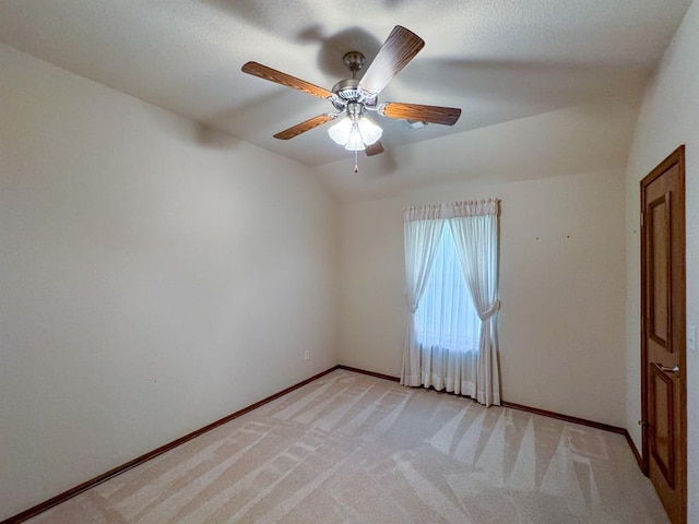 3424 Teton Ct, Norman, OK 73072 - empty room with light colored carpet, a ceiling fan, baseboards, and lofted ceiling
