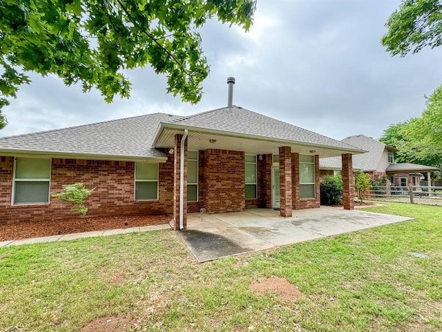 3424 Teton Ct, Norman, OK 73072 - back of property with brick siding, roof with shingles, and a patio