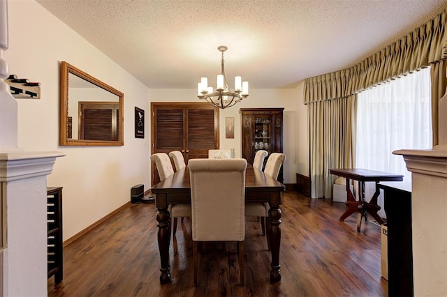 5708 NW 87th St, Oklahoma City, OK 73132 - dining room featuring a chandelier, dark wood-style floors, baseboards, and a textured ceiling