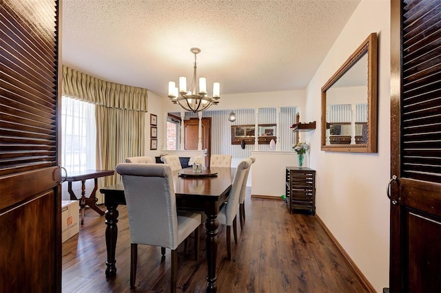 5708 NW 87th St, Oklahoma City, OK 73132 - dining area featuring a chandelier, dark wood-style floors, a textured ceiling, and baseboards