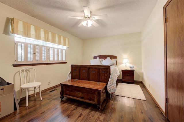 5708 NW 87th St, Oklahoma City, OK 73132 - bedroom featuring wood finished floors, baseboards, a textured ceiling, and a ceiling fan