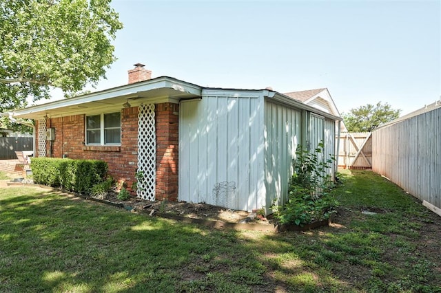 5708 NW 87th St, Oklahoma City, OK 73132 - view of property exterior with brick siding and a chimney