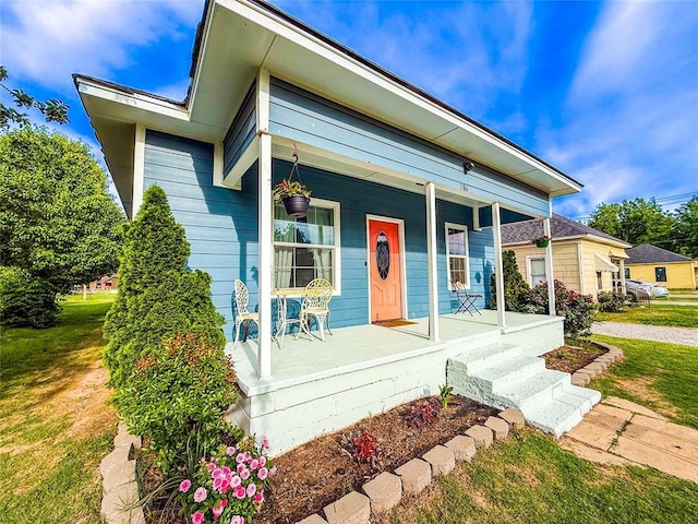 206 N Donald Ave, El Reno, OK 73036 - view of front of home featuring a porch and a front lawn