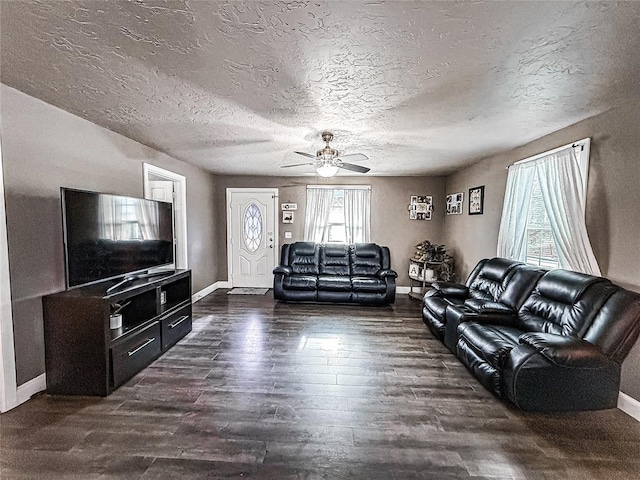 206 N Donald Ave, El Reno, OK 73036 - living area with baseboards, dark wood-style floors, a ceiling fan, and a textured ceiling
