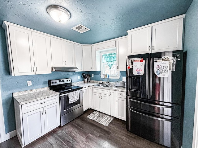 206 N Donald Ave, El Reno, OK 73036 - kitchen featuring stainless steel range with electric stovetop, black fridge with ice dispenser, under cabinet range hood, a sink, and light countertops